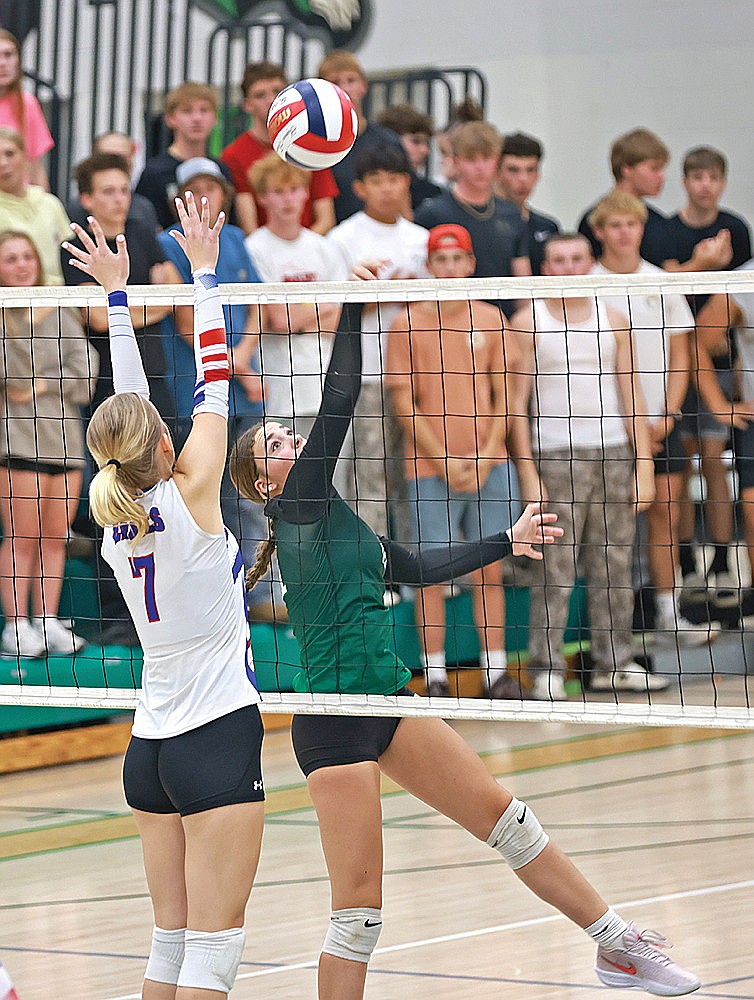 Rhinelander’s Addy Wiczek tips the ball against Northland Pines’ Mykala Felesena during a GNC volleyball match against Northland Pines at the Jim Miazga Community Gymnasium Tuesday, Sept. 30. (Bob Mainhardt for the River News)