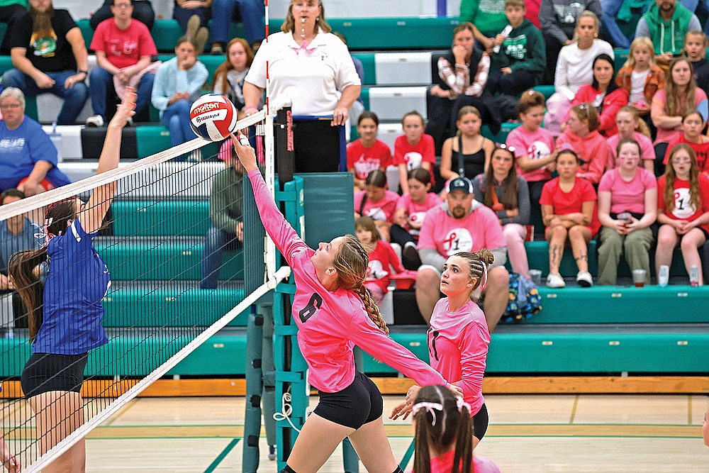 Rhinelander’s Ellie Cummings tips a ball at the net during a GNC volleyball match against Merrill at the Jim Miazga community Gymnasium Tuesday, Oct. 7. (Bob Mainhardt for the River News)