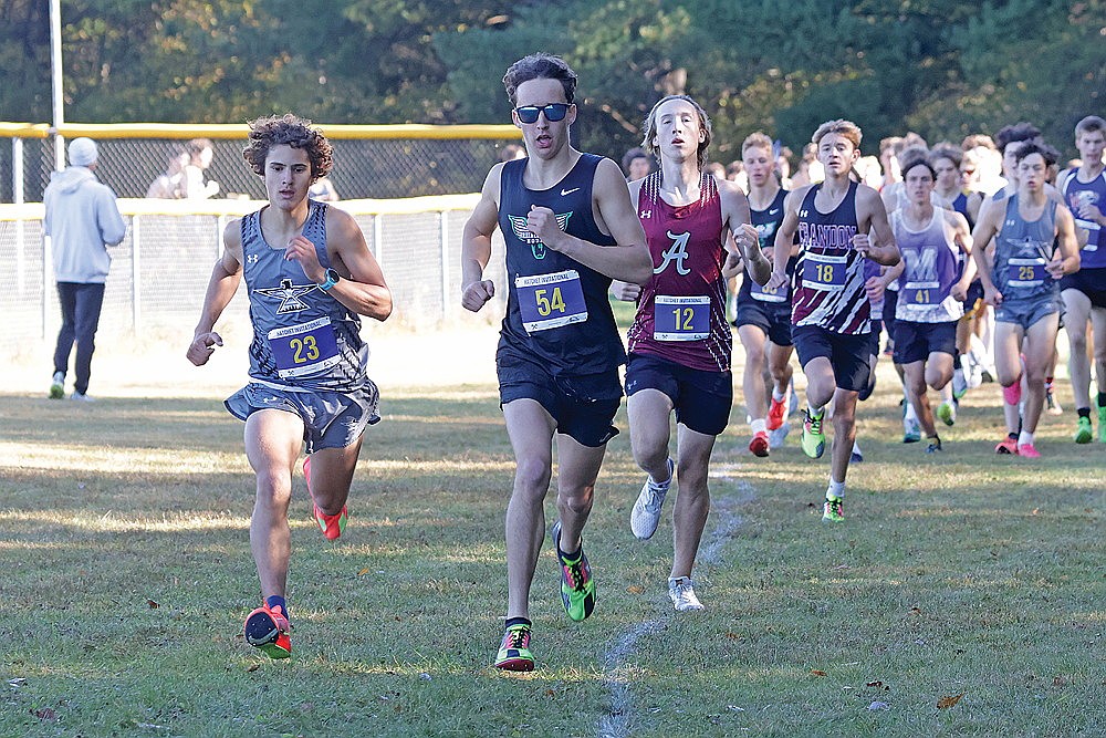 Rhinelander’s Avrom Barr leads Lakeland’s Brayden Kelly (23) and Antigo’s Shepard Snider (12) during the early stages of the Hatchet Invite cross country race in Tomahawk Saturday, Oct. 11. Barr won the boys’ race with a time of 16 minutes, 20.6 seconds and enters as one of the favorites to win the individual GNC boys’ title this coming Saturday when the Hodags host the conference championship at Northwood Golf Club. (Jeremy Mayo/River News)