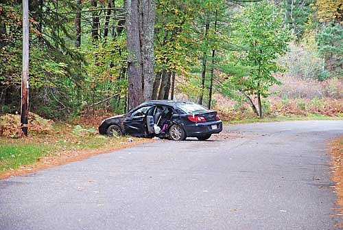 A 2008 Chrysler Sebring sedan sits where it landed following a rollover crash on Lemma Creek Road in Arbor Vitae on Oct. 6. (Photo by Brian Jopek/Lakeland Times)