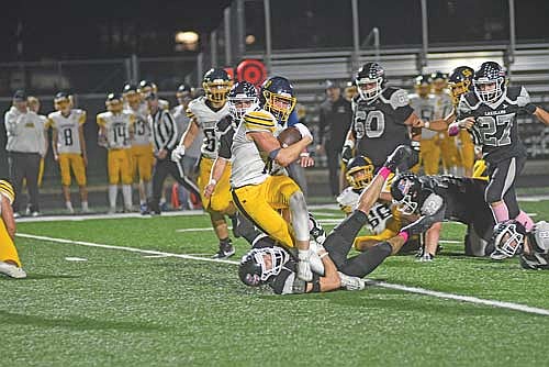 Nolan Johnson tackles Tomahawk’s Tiegan Sarazin in the fourth quarter of a conference game Friday, Oct. 17 at IncredibleBank Field in Minocqua. Sarazin scored three touchdowns. (Photo by Brett LaBore/Lakeland Times)