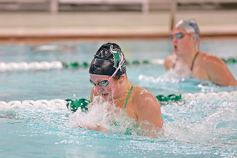 Rhinelander’s Vivian Lamers leads Merrill’s Marissa Miles in the 100-yard breaststroke during a GNC girls’ swimming dual meet at the Heck Family Community Pool Thursday, Oct. 16. Lamers won all four of her events Thursday as the Hodags wrapped up dual meet play undefeated with a 126-41 victory over the Bluejays. (Bob Mainhardt for the River News)