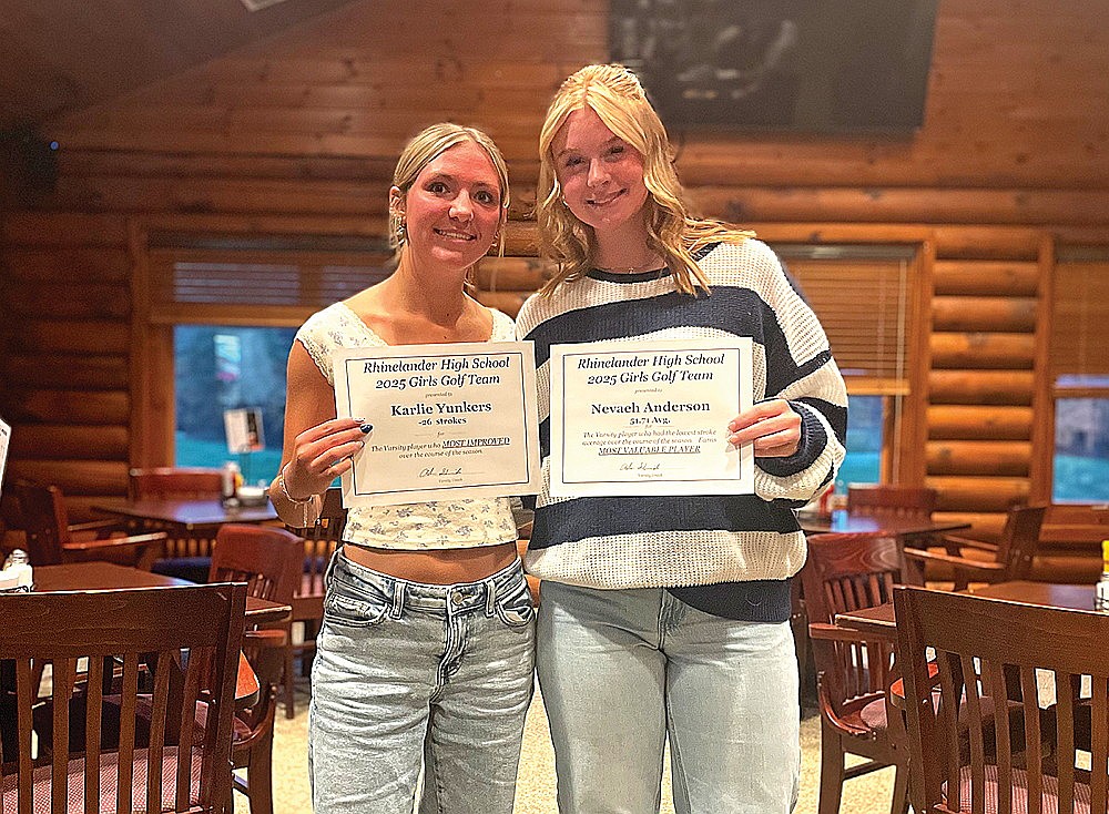 Karlie Yunkers, left, and Nevaeh Anderson, right, pose for a photograph with their awards following the Rhinelander High School girls’ golf team banquet at Northwood Golf Club Tuesday, Oct. 14. Yunkers earned the team’s most improved honors while Anderson received the team’s most valuable player award. (Jeremy Mayo/River News)
