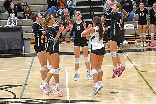 The Thunderbirds celebrate an ace in the third set of a WIAA Division 2 regional quarterfinal match against Ashland Tuesday, Oct. 21 at the Lakeland Union High School fieldhouse in Minocqua. Players pictured, clockwise, are Allyson Seaberg, Vivian Pertile, Greta Johnson, Sloane Timmerman and Ava Evenhouse. Lakeland totaled nine aces in the match. (Photo by Brett LaBore/Lakeland Times)