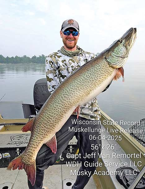 Jeff Van Remortel of Hazelhurst set a new state record musky in the live release category when he landed this 56-inch monster on Green Bay while he was guiding a client June 4. (Contributed photograph)
