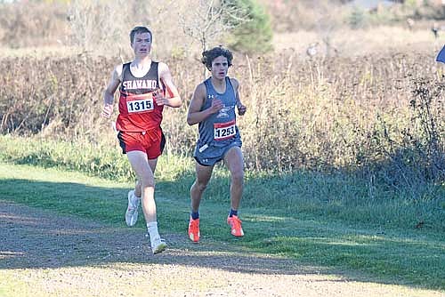 Brayden Kelly, right, runs side-by-side with Shawano’s Josiah Kuehl during a WIAA Division 2 sectional meet Friday, Oct. 24 at Merrill Area Recreation Complex. Kelly finished fourth with a time of 17:24.67. (Photo by Brett LaBore/Lakeland Times)