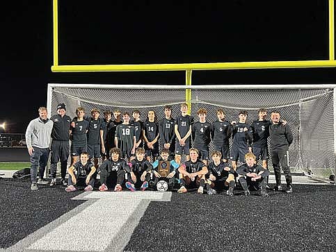 The LUHS boys’ soccer team celebrates its regional championship following a 2-0 win over Mosinee Saturday, Oct. 25 at IncredibleBank Field in Minocqua. Team pictured, back row from left, are coach Jeff Fricke, coach Tom Wise, Will Kimball, Michael Melka, Jennings Kern, Brayden Meade, Isaiah Reimer, Cael Skubal, Ty Morales, Kaden Carlson, Brady Wolfe, Jaydan Schilling, Easton Kellner, Cam Bernard, Oren Slemmons, head coach Ihor Myshchyshyn; front row, Drew Seeliger, Kenyon Carpenter, Ethan Seeliger, Talan Pockat, Marshall Holmquist, Lincoln Friedley and Connor Erickson. (Contributed photograph)