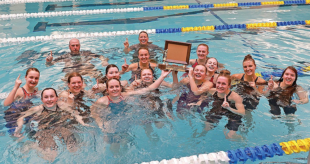 The Rhinelander High School girls’ swim team celebrates with the Great Northern Conference championship trophy after the GNC meet in Rice Lake Friday, Oct. 24. It marked the seventh straight conference title for the Hodags. (Bob Mainhardt for the River News)