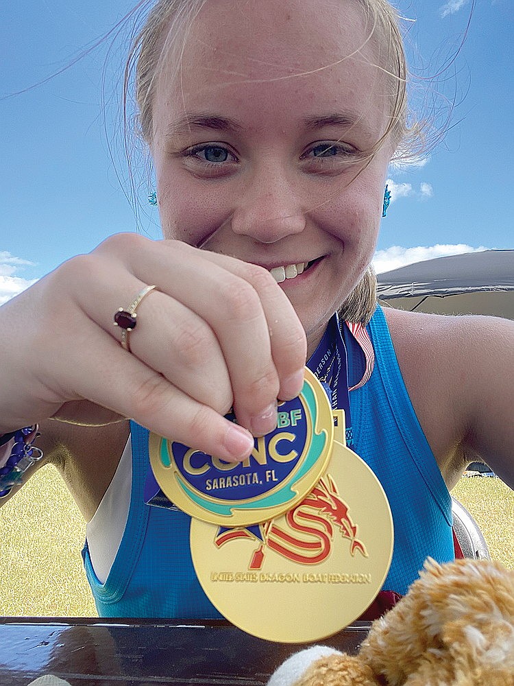 Rhinelander native Emma Mankus displays medals won during the U.S. Dragonboat Federation’s Club Crew National Championships held Oct. 17-19 in Sarasota, Fla. Mankus, who has Cerebral Palsy, was part of Paradragons USA and the Collective Racing Team, which became the first fully-inclusive team of para-athletes and support paddlers to compete in the event. (Submitted photo)