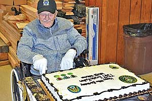 World War II veteran Erwin “Erv” Kuhn cuts the birthday cake during his 100th birthday celebration at Rhinelander’s VFW Post 3143 on Oct. 24. (Contributed photograph)