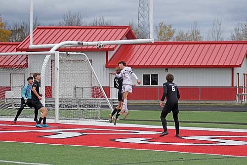 Somerset’s Max Cochran heads the ball towards the net in the second half of a WIAA Division 3 sectional final game against Lakeland Saturday, Nov. 1 at Raider Field in Medford. The Spartans scored the game-winning goal on the play, assisted by Cochran. (Photo by Brett LaBore/Lakeland Times)