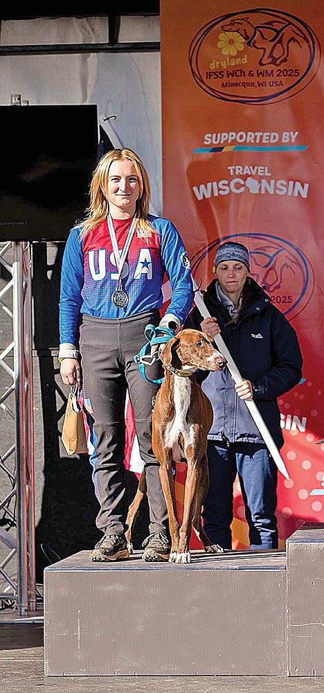 Niina Baum, far left, stands on the podium with her dog Dusty after her second-place finish in the 1-Dog Scooter at the IFSS Dryland Mushing World Championships Oct. 21-26 at Minocqua Winter Park. (contributed photograph)