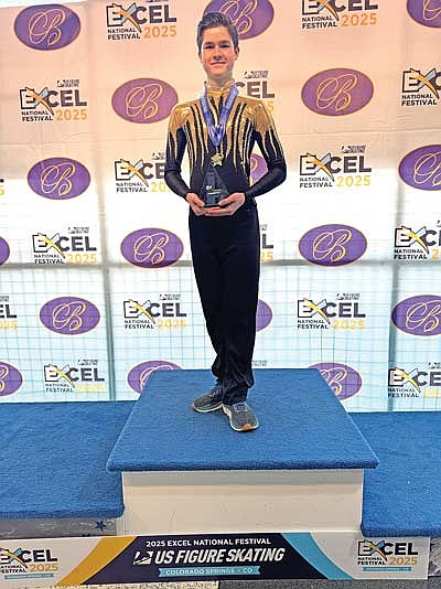 Nick Theis stands on top of the podium after winning his second first place national title in the last three years for Lakeland during the Excel National Final and Festival July 9-13 at the Broadmoor World Arena in Colorado Springs, Colo. (Contributed photograph)