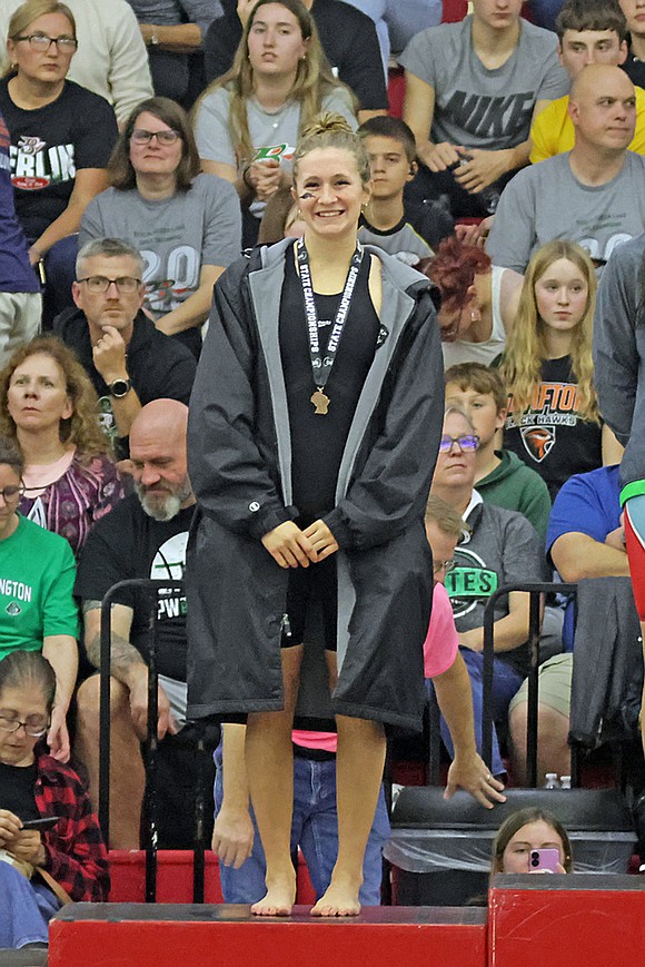 Rhinelander’s Vivian Lamers stands on the podium following a fourth-place finish in the 50-yard freestyle at the WIAA Division 2 state girls’ swim meet in Waukesha Friday, Nov. 14. (Jeremy Mayo/River News)