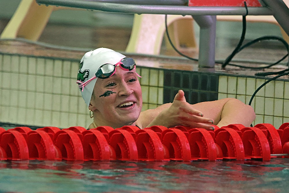 Rhinelander’s Vivian Lamers extends a hand to congratulate Hannah Tubbs of Black River Falls following 100-yard freestyle during the WIAA Division 2 state girls’ swim meet in Waukesha Friday, Nov. 14. Tubbs and Lamers finished 1-2 in the event. (Jeremy Mayo/River News)