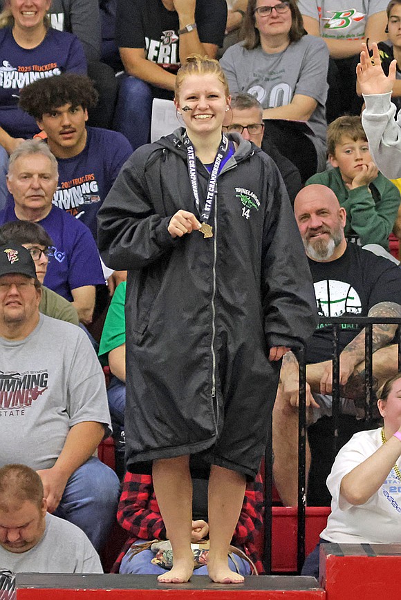 Rhinelander’s Millie Gruett stands on the podium following a fifth-place finish in the 100-yard butterfly at the WIAA Division 2 state girls’ swim meet in Waukesha Friday, Nov. 14. (Jeremy Mayo/River News)