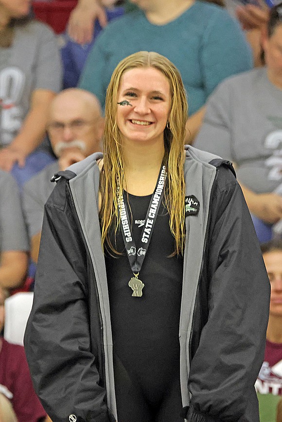 Rhinelander’s Vivian Lamers stands on the podium following a runner-up finish in the 100-yard freestyle at the WIAA Division 2 state girls’ swim meet in Waukesha Friday, Nov. 14. (Jeremy Mayo/River News)