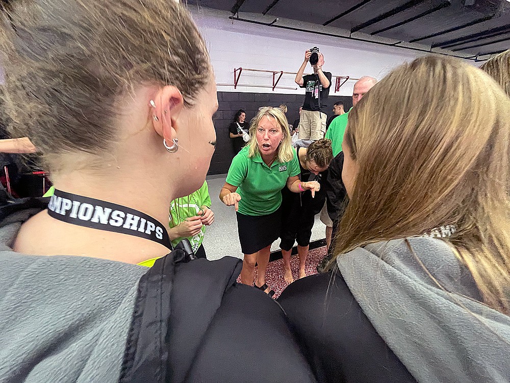 Rhinelander’s coach Jenny Heck addresses her team following the WIAA Division 2 state girls’ swim meet in Waukesha Friday, Nov. 14. (Jeremy Mayo/River News)