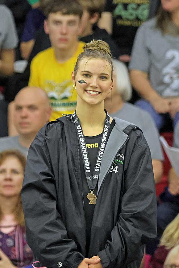 Rhinelander’s Ella Heck stands on the podium following a third-place finish in the 100-yard freestyle at the WIAA Division 2 state girls’ swim meet in Waukesha Friday, Nov. 14. (Jeremy Mayo/River News)