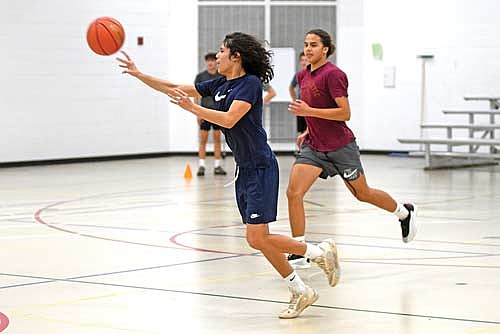Eric Zimmerman, left, and Parker Allen run through a drill during the first day of practice Monday, Nov. 17 at the Lakeland Union High School fieldhouse in Minocqua. (Photo by Brett LaBore/Lakeland Times)