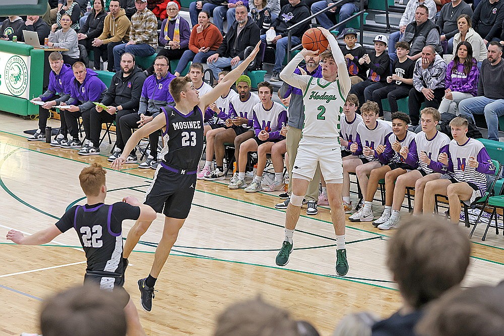 In this Feb. 21, 2025 file photo, Rhinelander’s Devon Feck attempts a jump shot over Mosinee’s Treve Stoffel during the first half of a GNC boys’ basketball game at the Jim Miazga Community Gymnasium. Feck, who averaged 13.0 points per game for the Rhinelander last season is one of four all-conference players returning for the Hodags as they seek their third consecutive conference title. (Bob Mainhardt for the River News)
