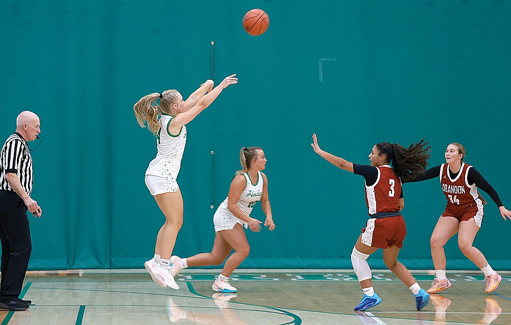 Rhinelander’s Teagan Clark hits a 3-pointer over Crandons Elyssa Bailey (3) during the first half of a non-conference girls’ basketball game at the Jim Miazga Community Gymnasium. Clark scored 19 points in her varsity debut as the Hodags defeated the Cardinals, 74-15. (Bob Mainhardt for the River News)