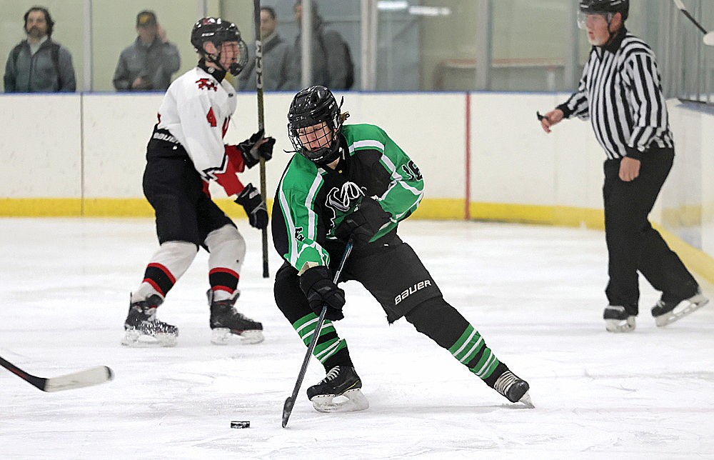 In this Jan. 11, 2025 file photo, Rhinelander’s Drake Nelson handles the puck at neutral ice during the second period of a non-conference boys’ hockey game in Merrill. Nelson, a senior, led the Hodags with 11 goals last season. (Jeremy Mayo/River News)