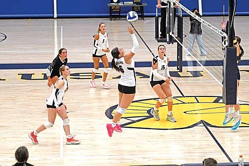 In this Sept. 22, 2025 file photo, Marlee Strasburg goes on the attack with teammates, from left, Allyson Seaberg, Greta Johnson, Sloane Timmerman and Ava Evenhouse looking on in a non-conference match against Wausau West at Wausau West High School. (Photo by Brett LaBore/Lakeland Times)