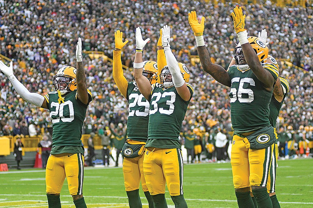 Green Bay Packers defenders, from left, Javon Bullard, Xavier McKinney, Evan Williams and Edgerrin Cooper celebrate following Williams’ interception in the fourth quarter against the Minnesota Vikings at Lambeau Field Sunday, Nov. 23. (Brett LaBore/Lakeland Times)