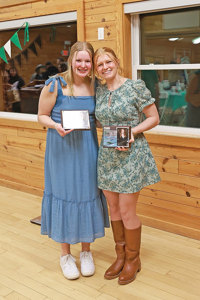Rhinelander’s Emma Houg, left, and Millie Gruett received the Hodag Award during the Rhinelander High School girls’ swim team banquet Monday, Nov. 24 at the Cedric A. Vig Outdoor Classroom. (Bob Mainhardt for the River News)