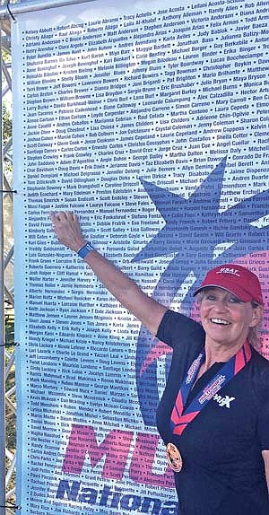 Mimi Fagan points to her name following the National Multisport Championships in Miami. The top five places in each category qualified for the World Championships held in Pontevedra, Spain. (Contributed photograph)