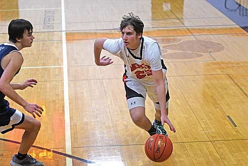 In this Dec. 19, 2024 file photo, Dylan Eith handles the basketball in a non-conference game against Tomahawk at Coach Leverson Court in Mercer. Eith figures to be one of Mercer’s top scorers in 2025-26. (Photo by Brett LaBore/Lakeland Times)