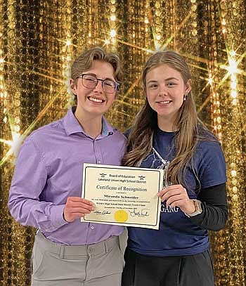 LUHS vocal music director  Briannah Wanca, left, and junior Miranda Schneider pose for a picture after being recognized by the district for making the high school state honors choir. (Contributed photograph)
