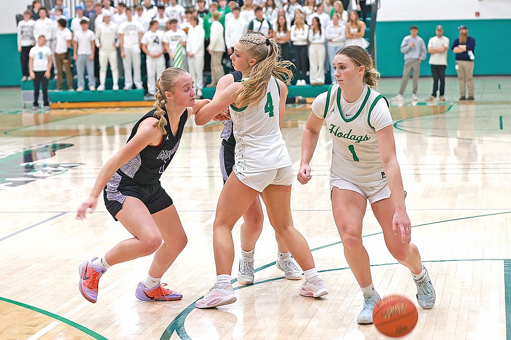 Rhinelander’s Aubryn Clark (1) works off a screen by Teagan Clark (4) while guarded by Mosinee’s Megan Treu during the second half of a GNC girls’ basketball game at the Jim Miazga Community Gymnasium Tuesday, Dec. 2. Rhinelander lost to Mosinee 43-32 as the Clark sisters were held to a combined three points in the second half. (Bob Mainhardt for the River News)