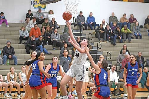 Ava Evenhouse makes a layup in the second half of the home and conference opener against Merrill Tuesday, Dec. 2 at Ted Voigt Court in Minocqua. Evenhouse led all scorers with 20 points. (Photo by Brett LaBore/Lakeland Times)