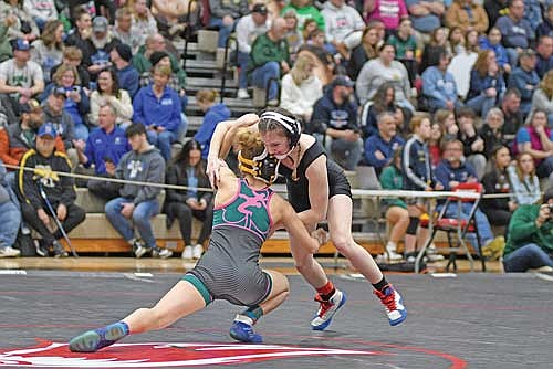 In this Feb. 21, 2025 file photo, Emma Brooks, right, goes up against Freedom’s Katherine Cook in the 100-pound weight class during a WIAA sectional meet at Shawano Community High School. (Photo by Brett LaBore/Lakeland Times)