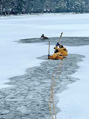 Firefighters Nathan and Jacob Gebhardt were able to rescue a deer that fell through the ice on Lost Lake the morning of Dec. 2 in St. Germain. (Contributed photograph)