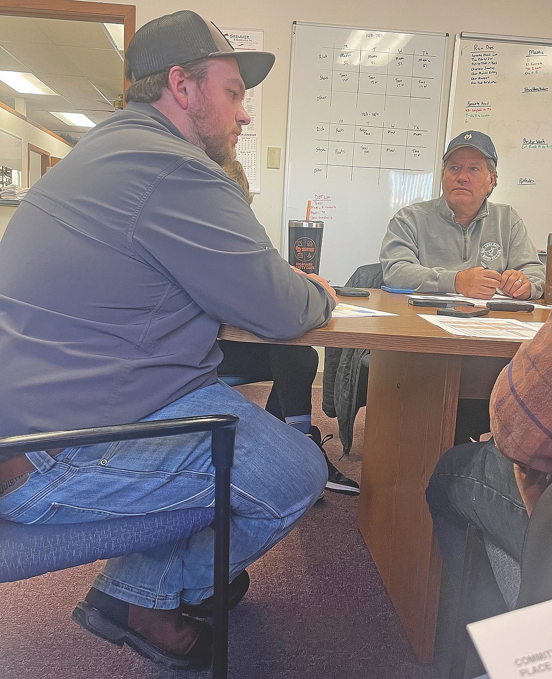 Oneida County board member Billy Fried, right, a member of the county board’s public works committee, listens as county highway commissioner Alex Hegeman answers a question during the committee’s Dec. 4 meeting. (Photo by Brian Jopek/Lakeland Times)