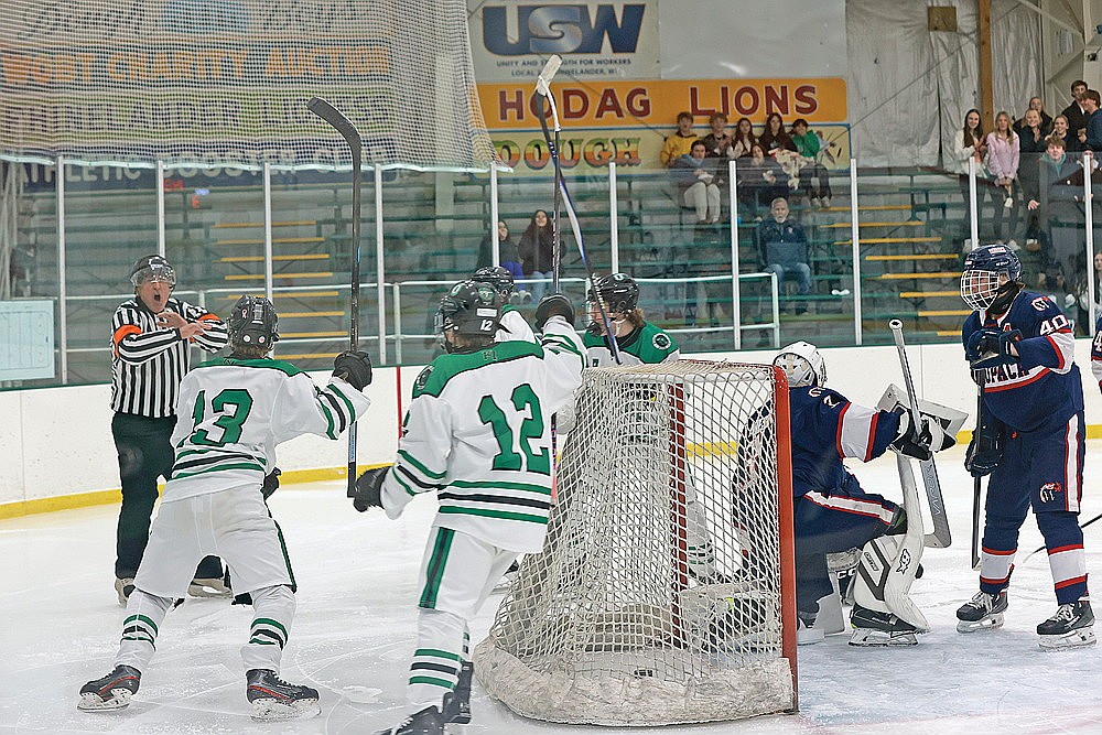 Members of the Rhinelander High School boys’ hockey team celebrate prematurely as a potential game-tying goal was disallowed early in the third period of a GNC boys’ hockey game against Waupaca at the Rhinelander Ice Arena Tuesday, Dec. 9. Officials deemed that Drake Nelson kicked the puck into the Waupaca net. The Comets scored three unanswered goals from there to win the contest, 7-3. (Bob Mainhardt for the River News)