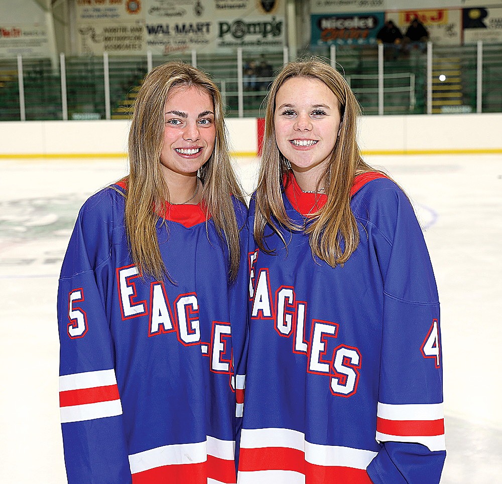 Rhinelander High School junior Reese Retallick, left, and freshman Lena Chiamulera pose for a photograph prior to a high school girls’ hockey game between the Northland Pines co-op Eagles and the Cap City (Sun Prairie West co-op) Cougars at the Rhinelander Ice Arena Friday. Dec. 5. Retallick and Chiamulera are the only two Rhinelander skaters on the Eagles this year — a co-op of Northland Pines, Rhinelander, Lakeland, Antigo, Three Lakes, Hurley and Norway (Mich.) high schools. (Bob Mainhardt for the River News)