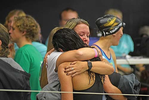 In this Nov. 14, 2025 file photo, Olivia Mickle and coach Tierney Edwards share a hug following Mickle’s final swim of her high school career during the WIAA Division 2 state meet at Waukesha South Natatorium. Mickle ended her prep swim career with two school records and was a four-time state participant. (Photo by Brett LaBore/Lakeland Times)