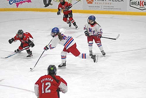Laine Jelinski shoots and scores in the first period of a game against Medford Tuesday, Dec. 16 at the Eagle River Recreation Association Sports Arena. (Photo by Brett LaBore/Lakeland Times)