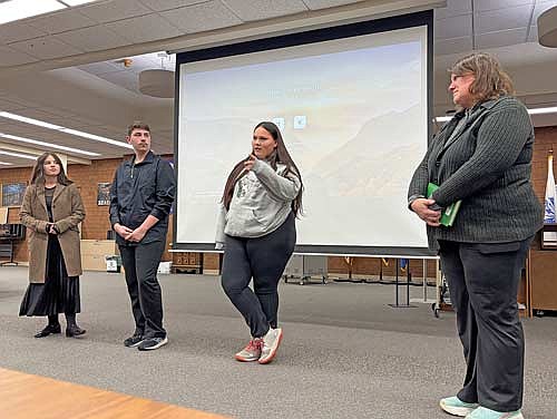 Teacher Mary Wentland, right, and students, from left, Eliza Ajrulai, Benjamin Harris and Ciara Poupart tell the board of education about a walking class they participate in that’s an alternative to a traditional gym class and how it’s been surprisingly enjoyable and informative. (Photo by Trevor Greene/Lakeland Times)