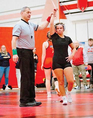 Moriah Louis is deemed the winner following a match at the WVC/GNC Challenge meet Tuesday, Dec. 16 at Wausau East High School. Louis made her season debut and finished in second place at the 136-142-pound weight class. Photo credit: Aaron Amershek. (Contributed photograph)