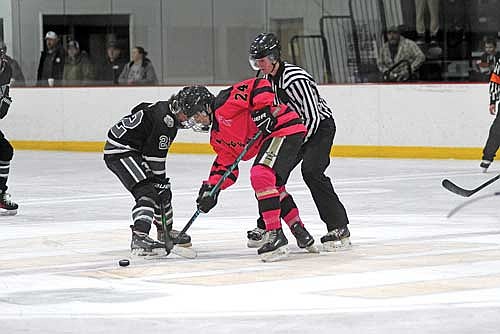 Bennett Schillinger, right, tries to win a face-off against West Bend’s Evan Behn in the first period of a 3-1 Lakeland win Friday, Dec. 19 at the Lakeland Hawks Ice Arena in Minocqua. The Thunderbirds are 3-0 against non-conference competition. (Photo by Brett LaBore/Lakeland Times)