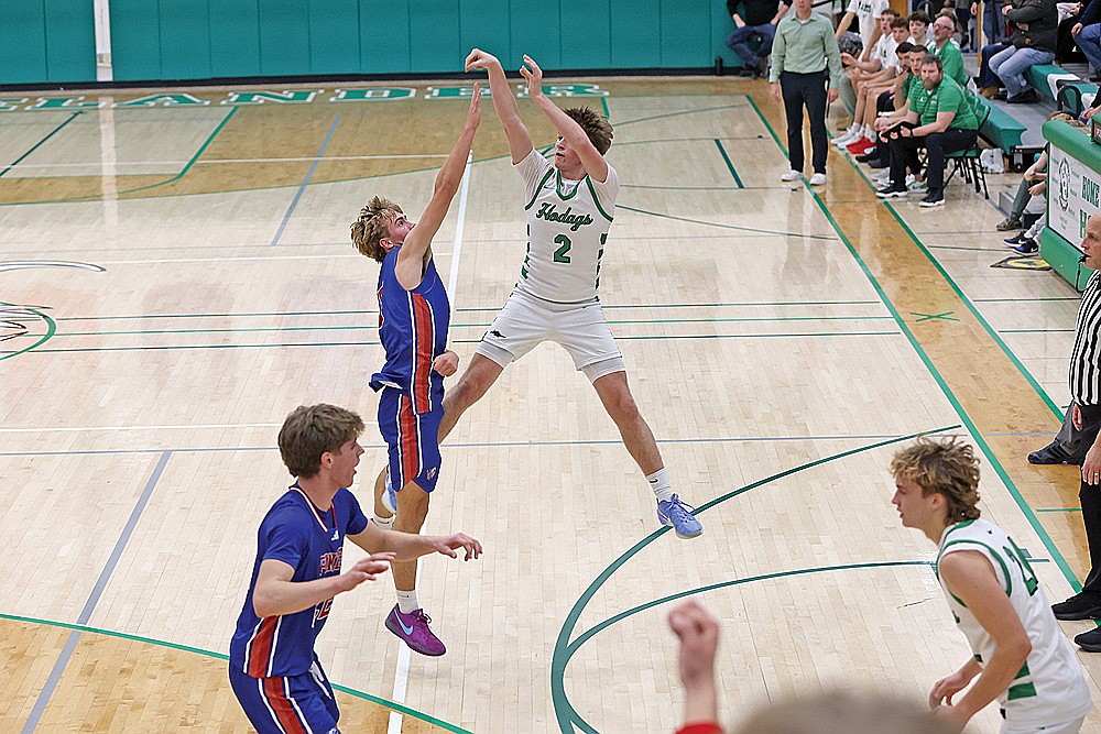 Rhinelander’s Devon Feck attempts a 3 over Northland Pines’ Jack Albrecht during the first half of a GNC boys’ basketball game at the Jim Miazga Community Gymnasium Friday, Dec. 19. Feck scored a game-high 24 points in the Hodags’ 60-55 win. (Bob Mainhardt for the River News)