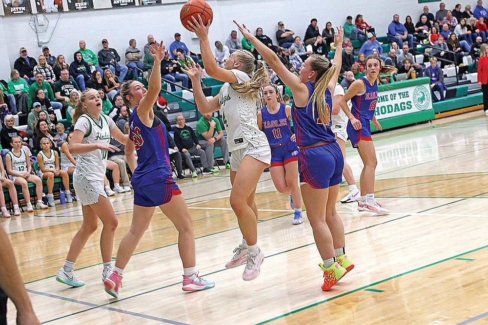 Rhinelander’s Teagan Clark puts up a shot between Northland Pines’ Kaydence Brost (20) and Ryyn Darr (12) during the second half of a GNC girls’ basketball game at the Jim Miazga Community Gymnasium Friday, Dec. 19. Clark scored a game-high 20 points in the Hodags’ 54-25 win. (Bob Mainhardt for the River News)
