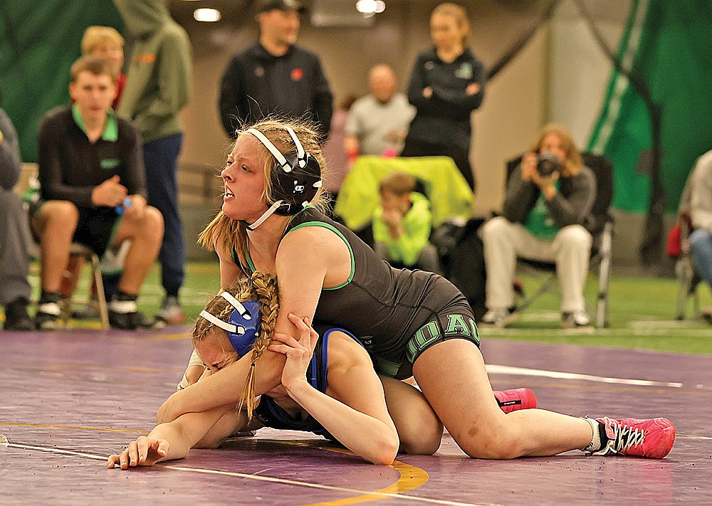 Rhinelander’s Cassidy Lindner controls Merrill’s Kendall Klug during the girls’ championship match at 126 pounds of the Hodag Scramble wrestling invite in the Hodag Dome Friday, Dec. 19. Lindner won the match, 14-10, to improve to 15-1 on the season. (Bob Mainhardt for the River News)
