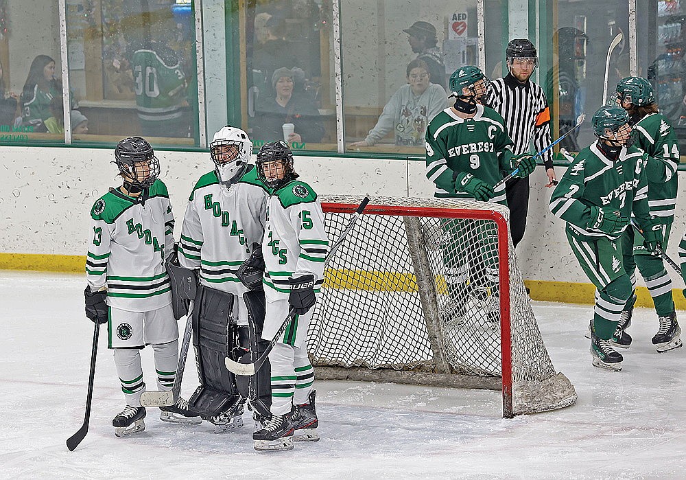 Rhinelander’s Drake Nelson (13), Connor McGee and Gabe Kennedy (15) react after D.C. Everest scores a goal during the first period of a non-conference boys’ hockey game at the Rhinelander Ice Arena Monday, Dec. 22. Everest scored eight times in the first period and went on to beat the Hodags, 12-0. (Bob Mainhardt for the River News)