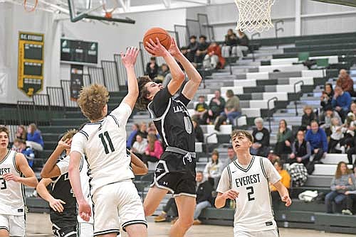 Benny Gahler attempts a shot in the second half of a non-conference game against D.C. Everest Monday, Dec. 29 at D.C. Everest Senior High School in Weston. Gahler scored eight points in his first game since Dec. 12. (Photo by Brett LaBore/Lakeland Times)